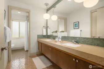 The second bath upstairs features this cool original 1965 vanity and floor tile, with a large frosted gloss offering lovely diffuse light to the tub area.
