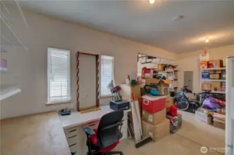 Garage has extra storage or work room space.
