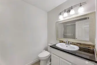 Upstairs bathroom, tub/shower enclosure on other side of bathroom