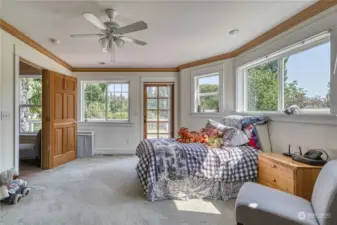 Bedroom #1 is a spacious, bright and cheery retreat. The door opens to the deck and has great views of the pastures.