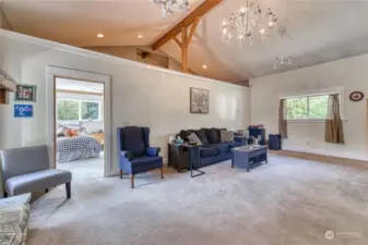 You will love the stunning living room, with vaulted beamed ceilings and accent lighting provides a very classy touch.. The door on the right goes to spacious bedroom #1.