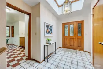 Back to the entry, hall past the coat closet to the left leads to guest bath/bedroom, primary bedroom, laundry and garage.