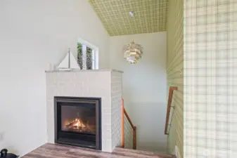 Stairwell with Beautiful Avocado Chandelier and Gorgeous Rail System.