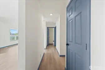 Hallway to the bedrooms, linen closet, bathroom and stairway