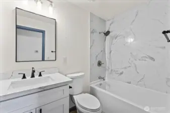 Hall bathroom with full tub.