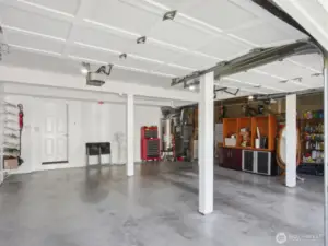A spacious three-car garage with separate automatic openers, a newer hot water tank, furnace heat pump A/C for year-round comfort,  plus the convenience of a central vacuum system.