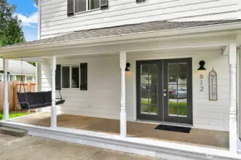 Welcoming front porch with a swing.