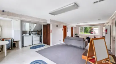 This generous multipurpose room awaits—ideal for setting up your washer and dryer, which are included, along with plenty of space for your other needs