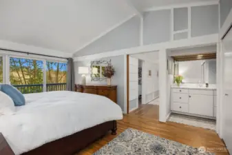 Primary bedroom and guest bedroom open up to one of the back decks.