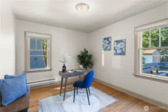 The main floor bedroom has bamboo flooring, newer paint and is so versatile! This would make a great office, guest room or primary bedroom with easy access to the full bath. Note the lovely backyard views out the window as well with afternoon sunshine!