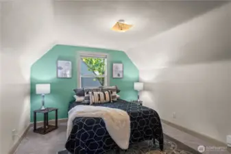 The spacious primary bedroom is the focus of the entire second floor. The accent wall gives a pop of fun color while the brand new carpet creates a comfy place to relax and unwind.