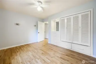 Bedroom two with built in closets and hardwood floor