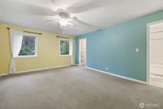 Primary bedroom with walk in closet and full bath
