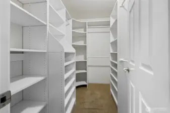 Primary bedroom walk in closet