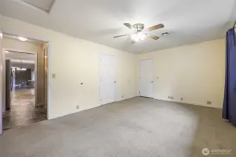Bonus room.  Doors lead back to kitchen area or laundry room/half bath or garage
