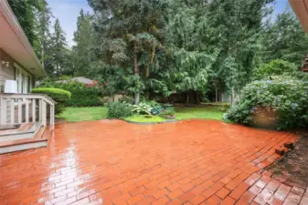 Brick patio in back yard. Located off of the main sliding door or laundry room