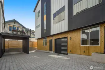The private drive provides direct garage access while offering a sense of community within this exclusive enclave.