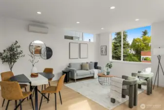 The living room becomes the heart of the home, where light dances across warm wood floors and creates a relaxing yet refined atmosphere.