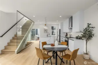 A sculptural staircase adds both drama and design sophistication, bridging each level with elegance.