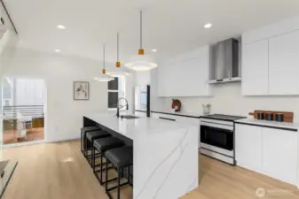 Abundant cabinetry paired with streamlined counters ensures that storage and function meet impeccable style.