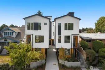 Architectural detailing enhances curb appeal, with layered textures, modern symmetry, and striking color contrasts.
