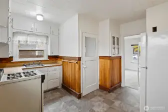 Kitchen. Door to basement laundry and storage space.