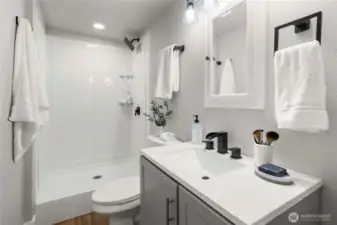 Downstairs bathroom with shower.