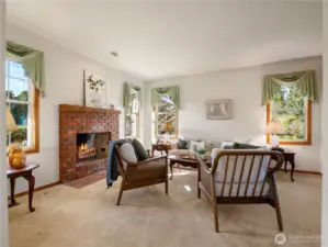 To your left when you enter the home you have a sunken living room with a cozy wood fireplace.
