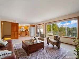 There is room for a kitchen table in the kitchen. The French doors lead out to the deck outside.