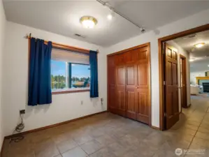 in the basement this bedroom is located just as you walk down the stairs.