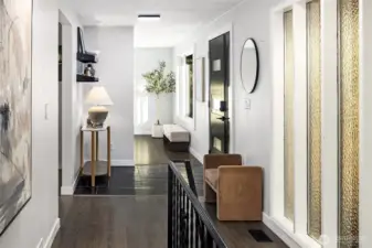 View of the foyer with its slate flooring and staircase leading to the ground level.