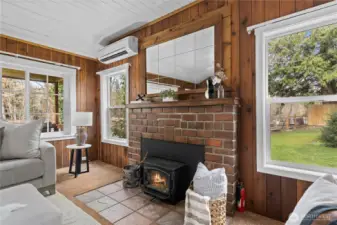 Mirror above stove is a 110 year old antique. Bricks that are in the fireplace surround and the chimney were resourced from City of Seattle in 1910 when they tore out original brick streets and repurposed in this historical home.