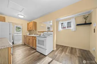 Well designed kitchen area just off the front door.
