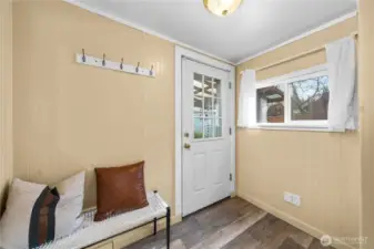 Convenient backdoor mudroom just off the kitchen.
