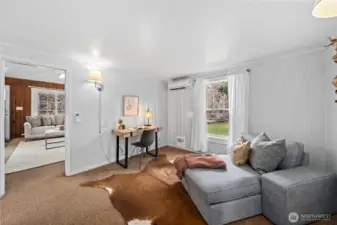 Bright, flexible space perfect for an office, playroom, or lounge.