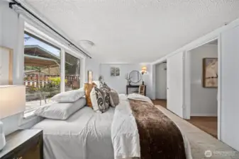 Bright and roomy bedroom with dual closets for ample storage.