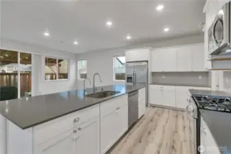 Another angle of the kitchen with even more cabinets built into the island.