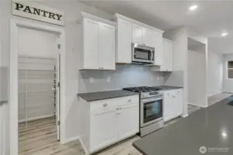 Convenient walk-in pantry perfect for organizing all your essentials.