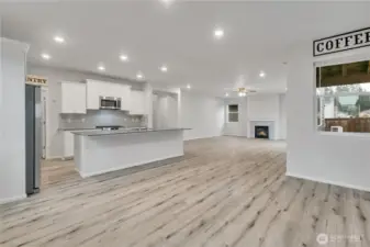 Look from the dining area into the bright, open-concept living space.