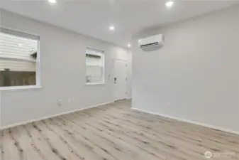 This home boasts a rare main-floor, fully functional mother-in-law suite with a separate private entrance.  This area is the living space.