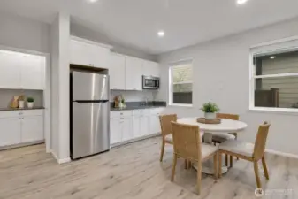 Generous MIL suite with a complete, functional kitchenette -Virtual staged.