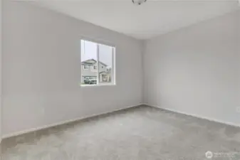 MIL suite bedroom enjoys privacy, separate from the living and kitchen spaces.