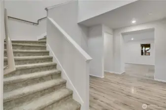Open and airy staircase leading to the home’s upper level.