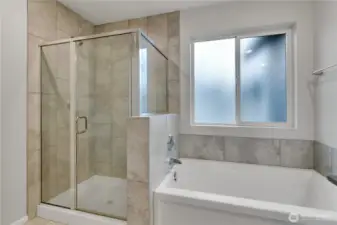 Modern primary ensuite featuring a roomy walk-in shower.