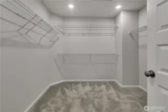 Generously sized walk-in closet for the primary suite.