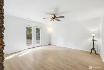 Downstairs rec room with french doors to the paver patio.