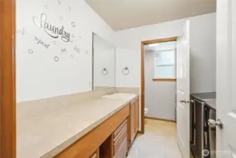 There is a 3/4 bath & large laundry room downstairs.