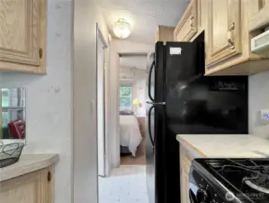 Hall from kitchen to bathroom and primary bedroom