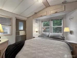 Another view of the primary bedroom showing natural light