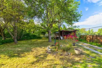 Large backyard for gardening, play, or lazy afternoons in a hammock.